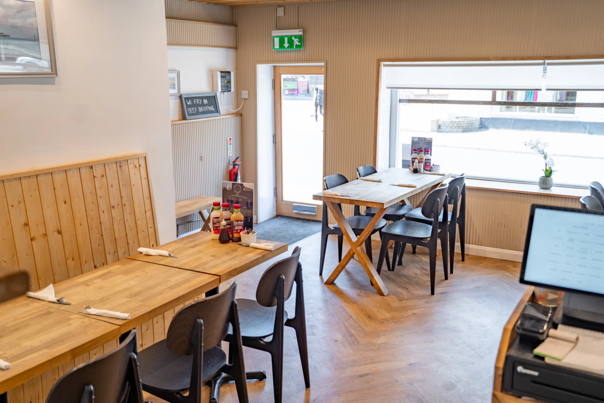 Cozy café interior with wooden tables.